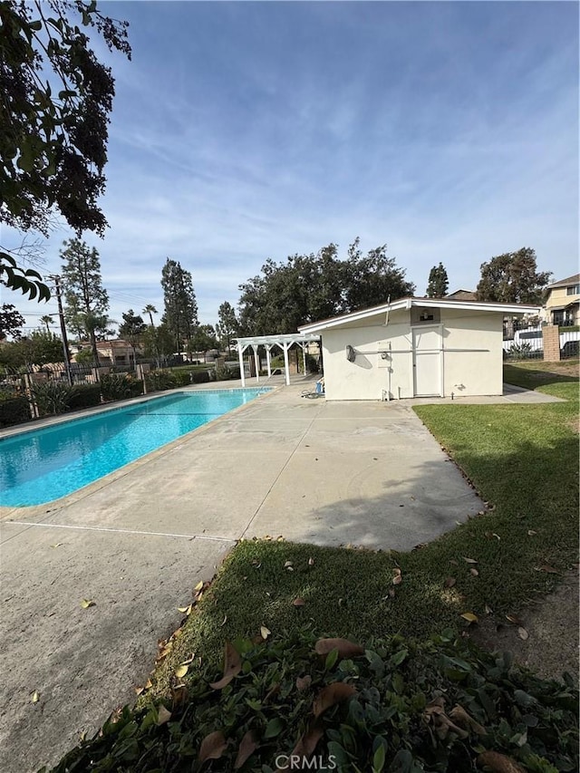 view of swimming pool with a patio