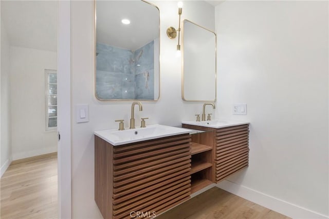 bathroom featuring vanity and wood-type flooring