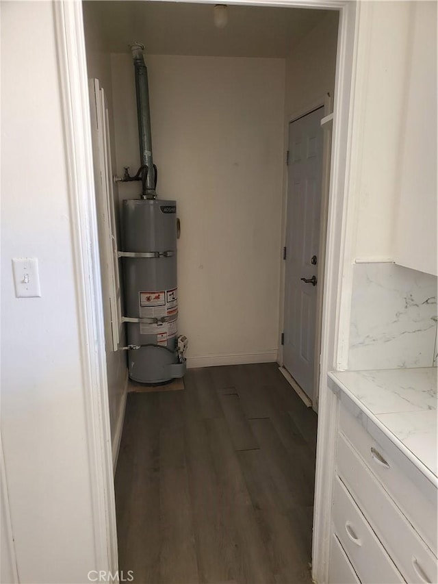 utility room with secured water heater