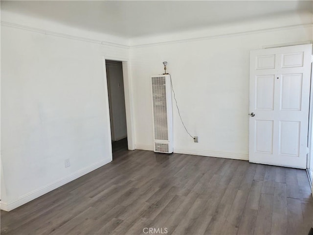 spare room featuring dark hardwood / wood-style floors