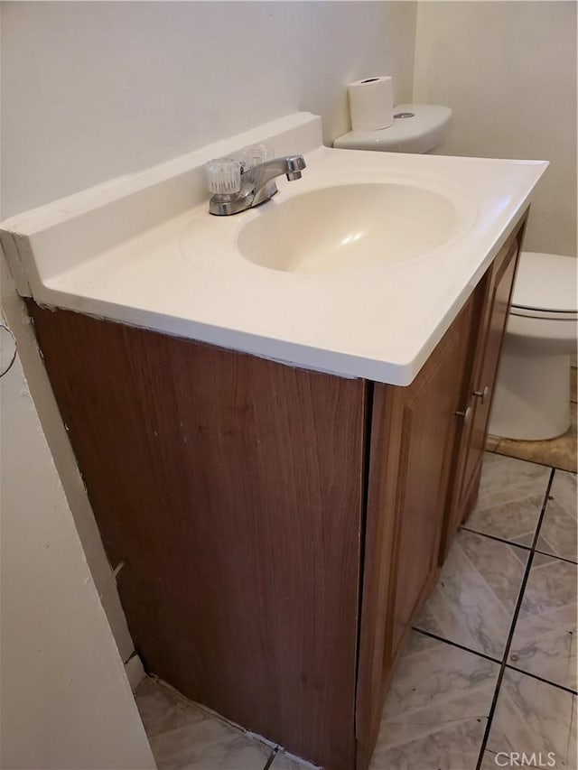 bathroom with vanity and toilet