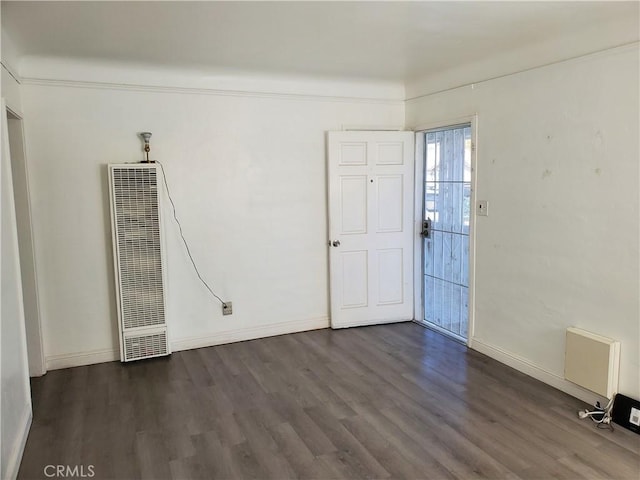 spare room featuring dark hardwood / wood-style floors