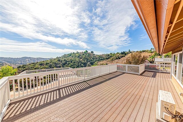 wooden terrace with a mountain view