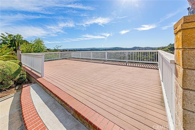 wooden terrace with a mountain view