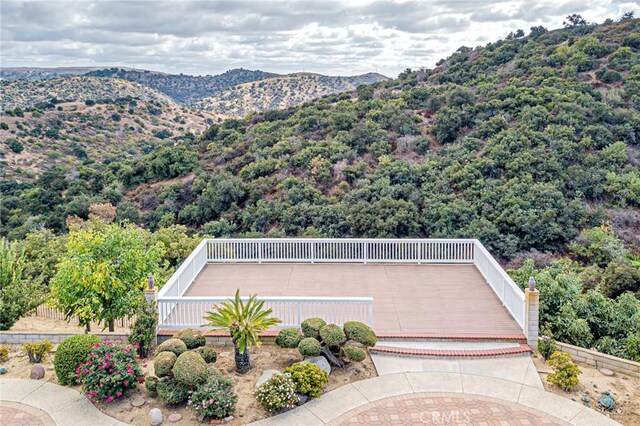 birds eye view of property featuring a mountain view