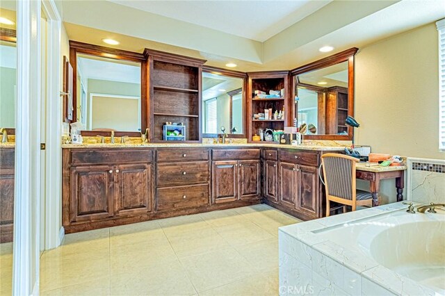 bathroom featuring vanity, a tub, radiator heating unit, and tile patterned floors