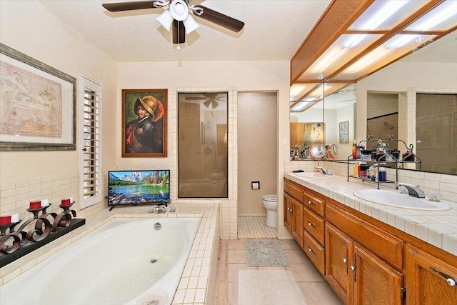 full bathroom with toilet, vanity, tile patterned floors, decorative backsplash, and plus walk in shower