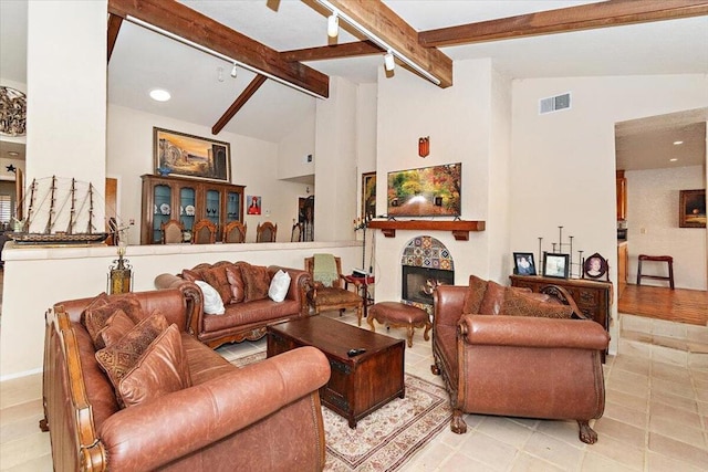 living room with lofted ceiling with beams