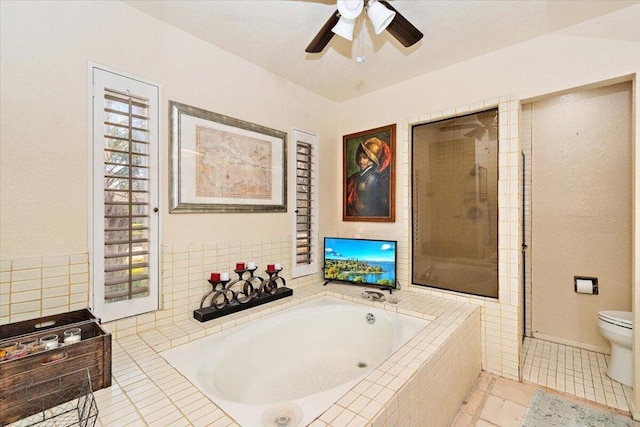 bathroom with toilet, ceiling fan, tile patterned floors, and plus walk in shower