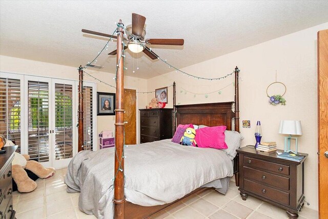 bedroom with a textured ceiling and ceiling fan