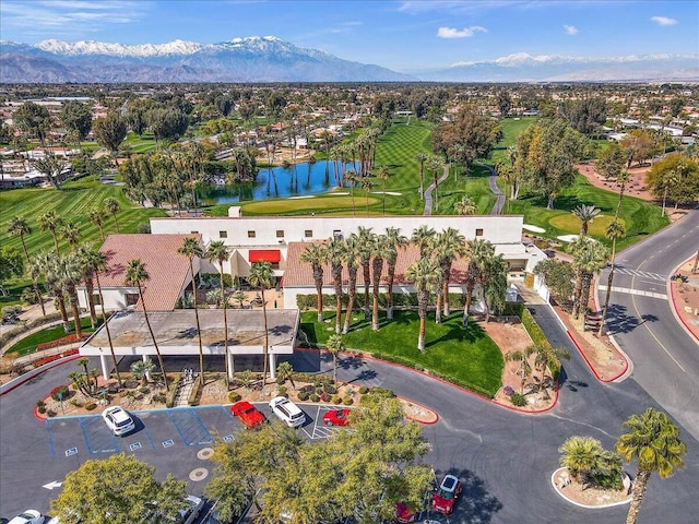 birds eye view of property featuring a water and mountain view