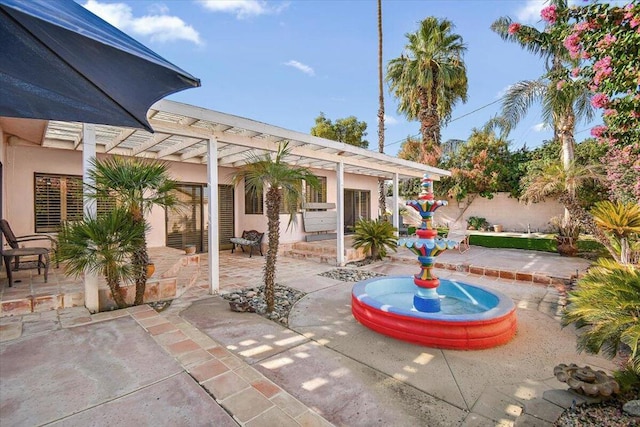 view of patio featuring a pergola