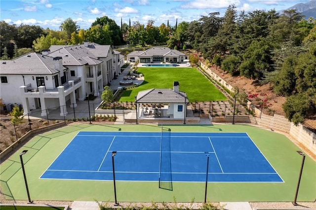 view of sport court featuring basketball hoop