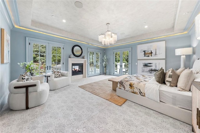 188 Deodar Ln, Bradbury, CA 91008 - bedroom featuring french doors, a tray ceiling, access to outside, a chandelier, and crown molding