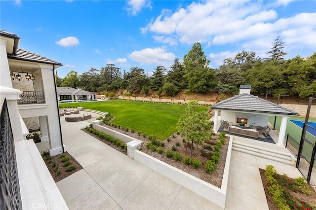 view of yard featuring a gazebo, an outdoor living space, and a patio area