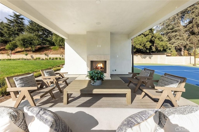 view of patio featuring exterior fireplace