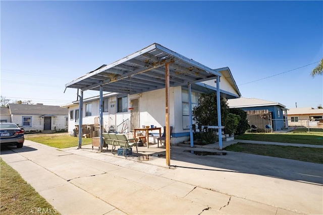 exterior space with a patio and a carport