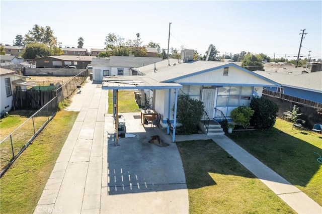 bungalow-style home featuring a front yard and a patio