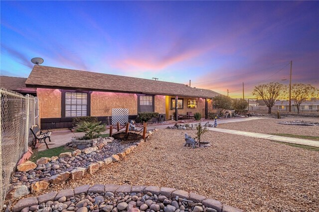 view of front of property featuring a patio