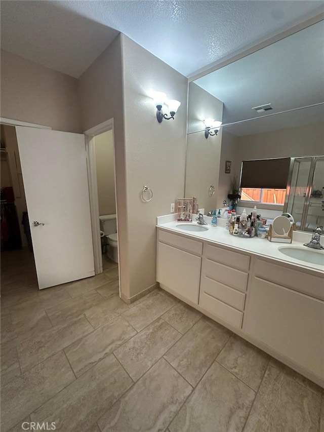 29822 Cool Meadow Dr, Menifee, CA 92584 - bathroom featuring double vanity and a shower stall