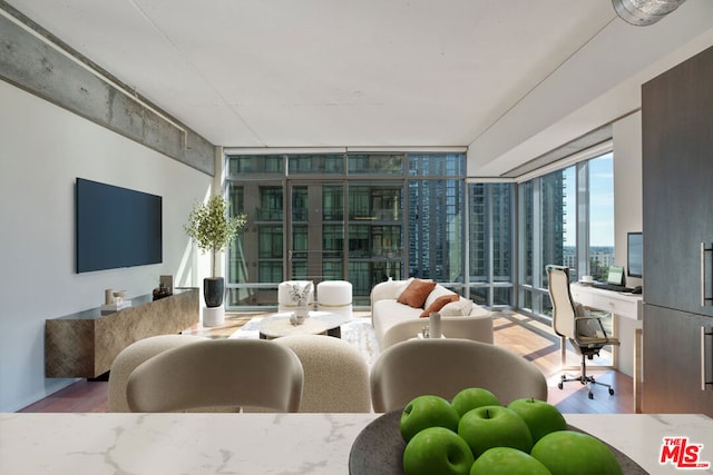 living room featuring floor to ceiling windows and wood-type flooring