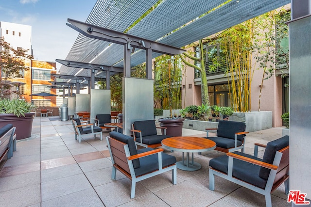 view of patio with outdoor lounge area and a pergola