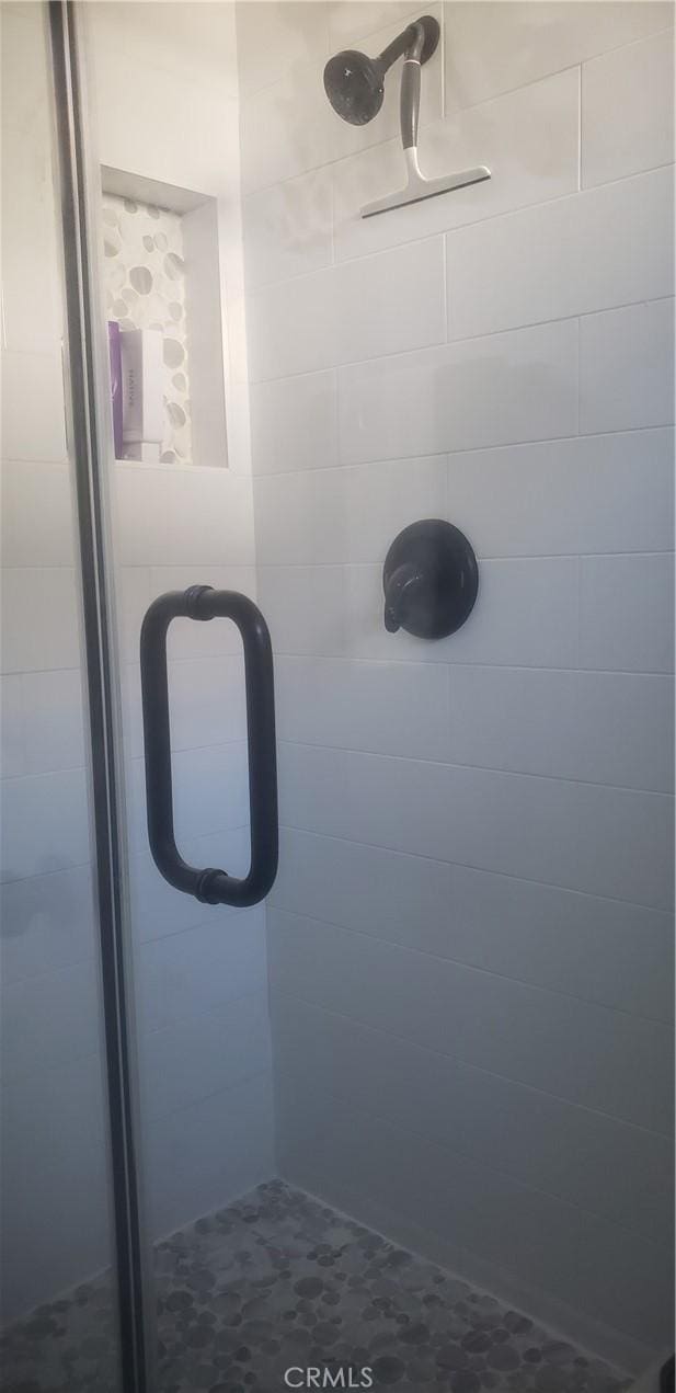 bathroom featuring walk in shower