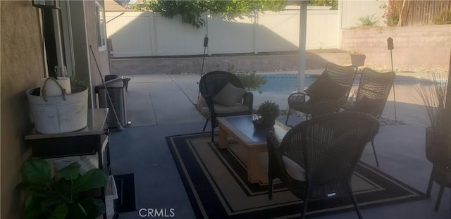 view of patio featuring a fenced in pool