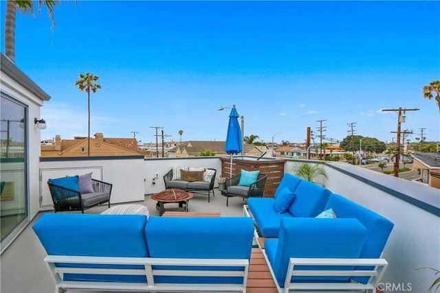 view of patio / terrace featuring an outdoor living space with a fire pit