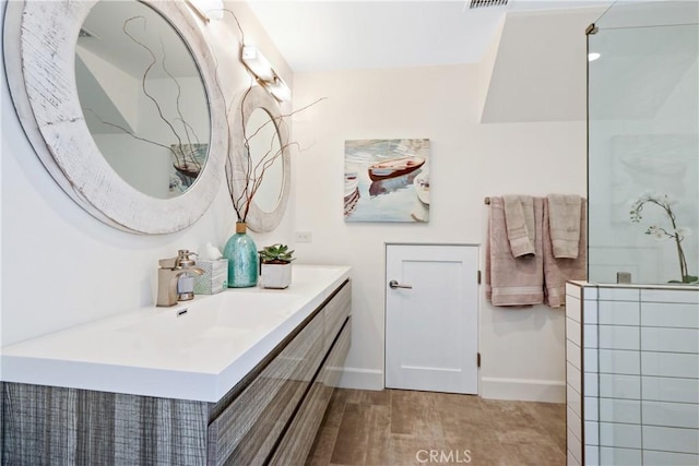 bathroom with hardwood / wood-style floors and vanity