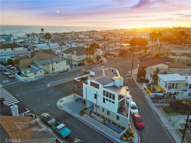 aerial view at dusk with a water view