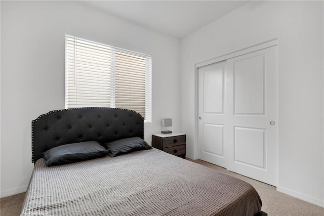 carpeted bedroom with a closet