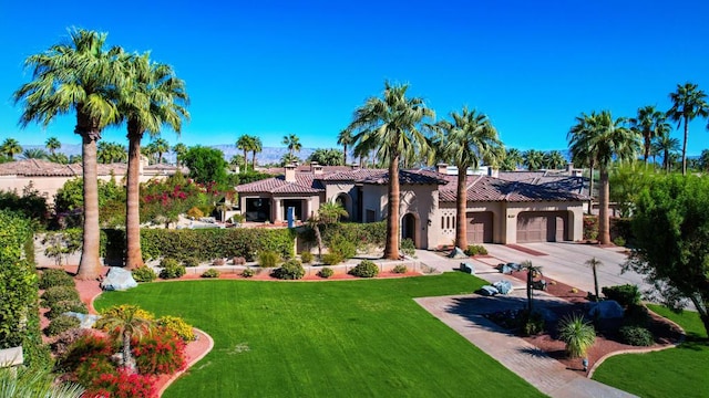 exterior space with a front lawn and a garage