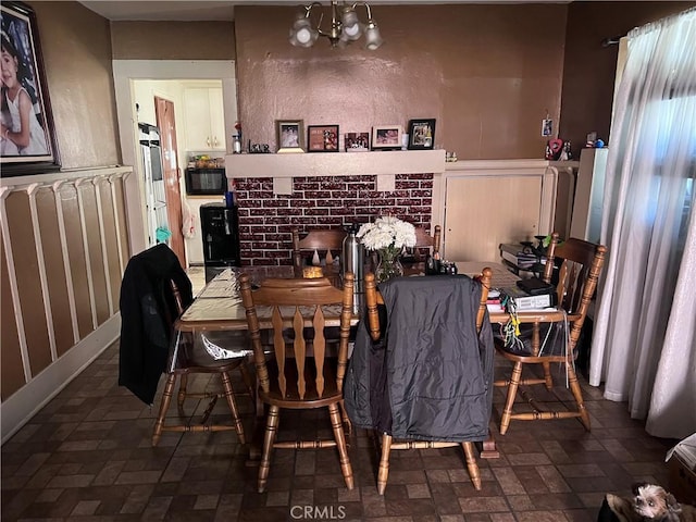 dining area featuring a notable chandelier