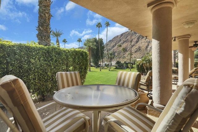 view of patio / terrace featuring a mountain view