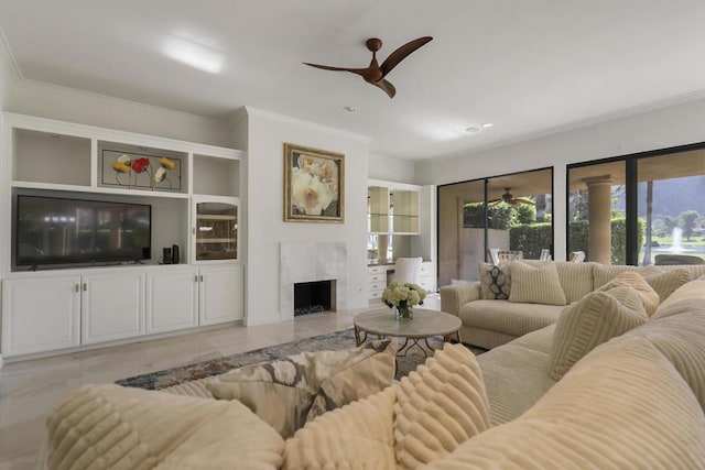 living room featuring crown molding, a fireplace, and light tile patterned floors