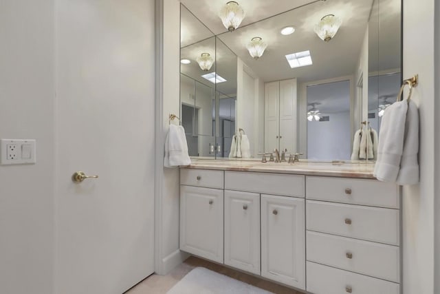 bathroom featuring vanity and ceiling fan