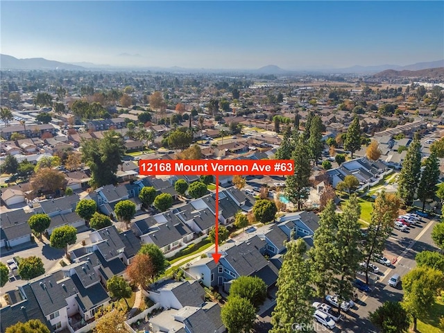 drone / aerial view featuring a mountain view