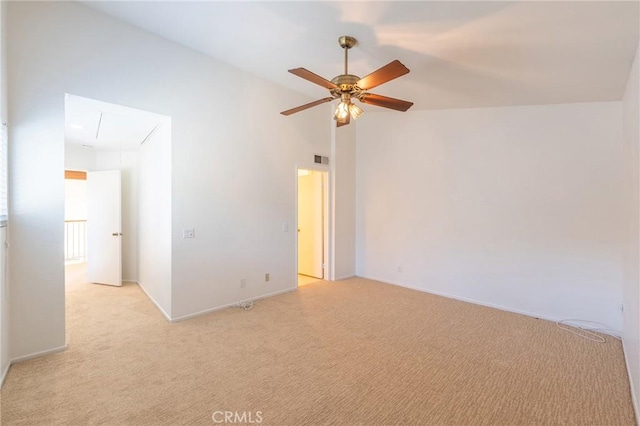 empty room featuring light carpet and ceiling fan