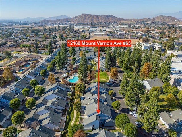 birds eye view of property with a mountain view