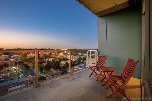 view of balcony at dusk