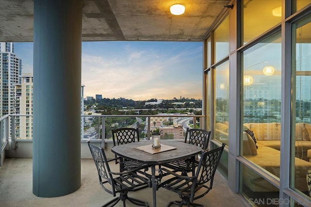 view of balcony at dusk