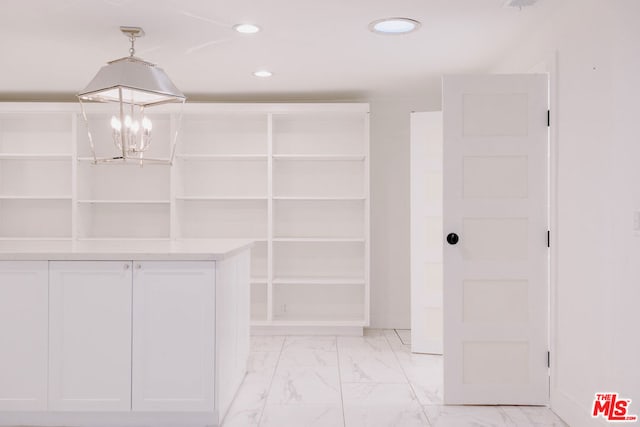 bathroom with an inviting chandelier