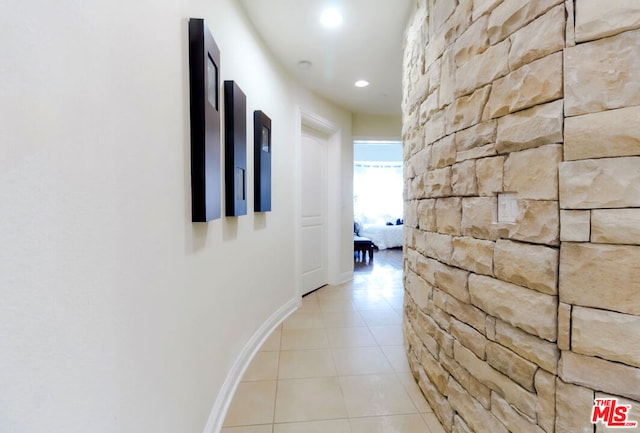 hallway with light tile patterned floors