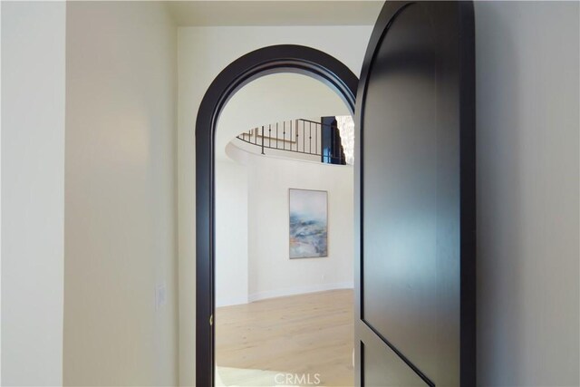 1 Rue Du Parc, Newport Beach, CA 92660 - hallway with light wood finished floors and arched walkways