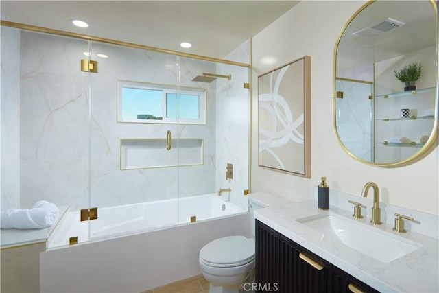 full bathroom with toilet, vanity, and combined bath / shower with glass door