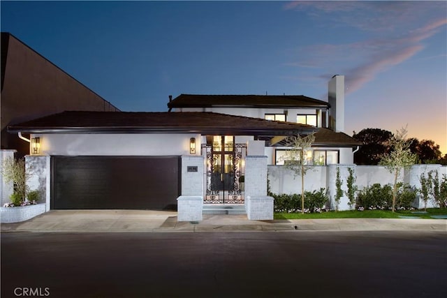 view of front of property with a garage