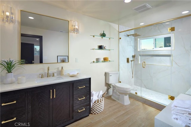 1 Rue Du Parc, Newport Beach, CA 92660 - bathroom with a marble finish shower, vanity, wood finished floors, and recessed lighting