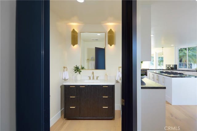 bathroom featuring sink and hardwood / wood-style floors