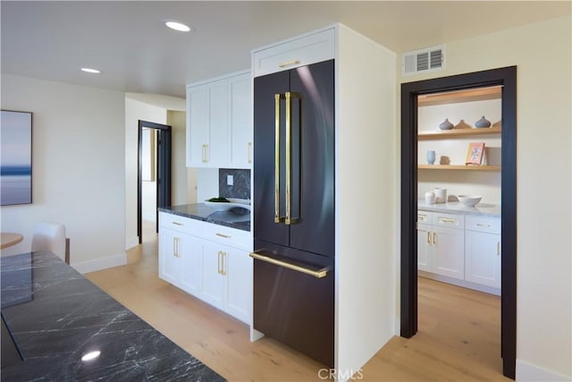 1 Rue Du Parc, Newport Beach, CA 92660 - kitchen with high end refrigerator, white cabinets, light wood-style floors, and recessed lighting